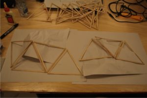 pushing wooden triangles around